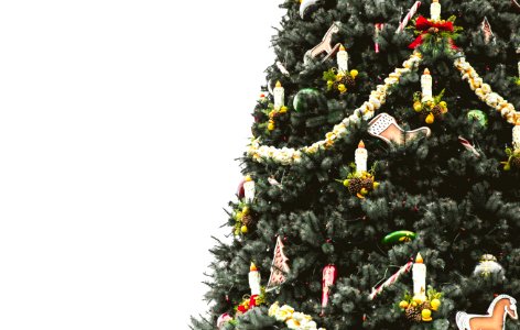 Christmas tree covered with ornaments and tinsels photo