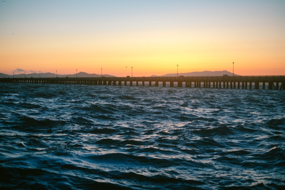 concrete bridge on body of water