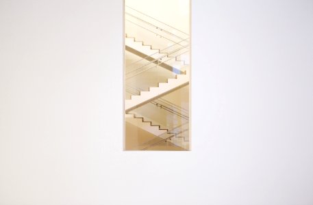 painting of stairs with white wooden frame photo