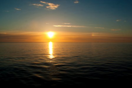 body of water during sunset