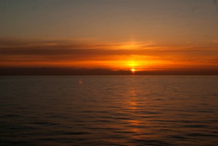 body of water during sunset