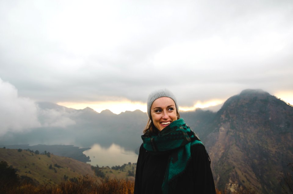 woman wearing green scarf smiling