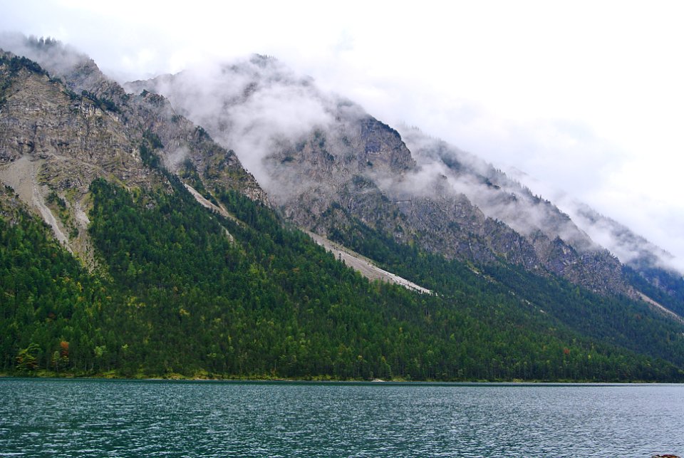 green and gray mountains under white cloudy sky
