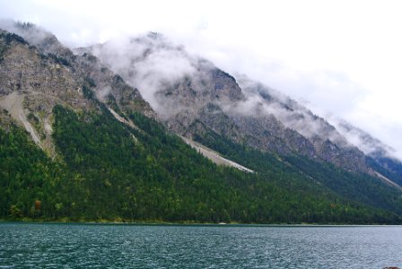 green and gray mountains under white cloudy sky photo