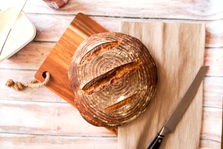 closeup photo of baked bread on chopping board photo