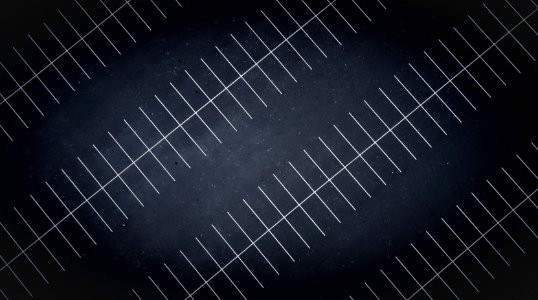 A drone view at night of parking lot lines