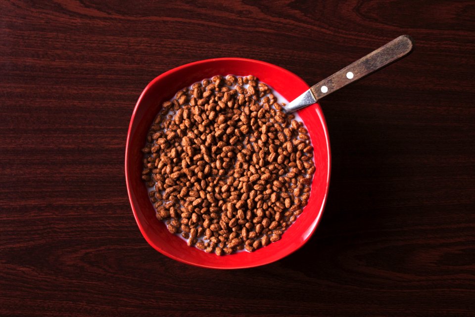 bowl of cereal with spoon on tabletop