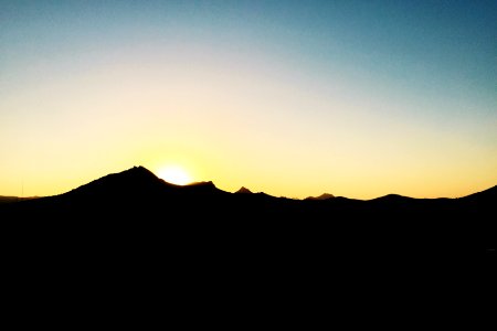 silhouette of mountain during golden hour photo