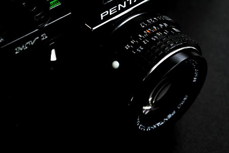 black Pentax SLR camera photo