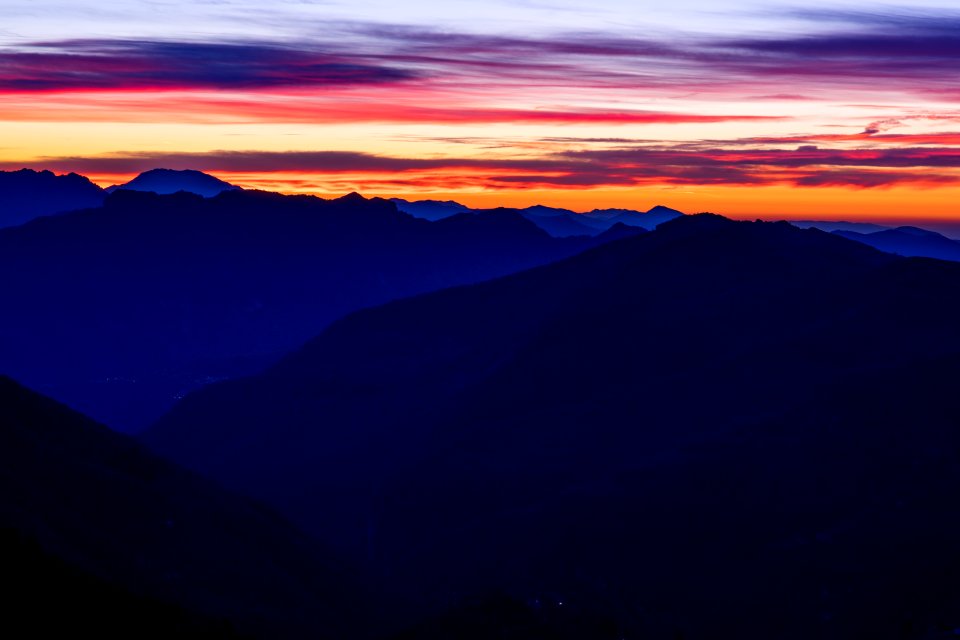 mountain ranges under orange sky during sunset