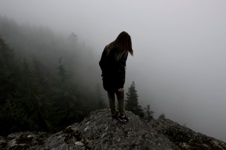 woman standing on hill photo