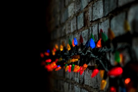 shallow focus photography of string lights at the wall photo