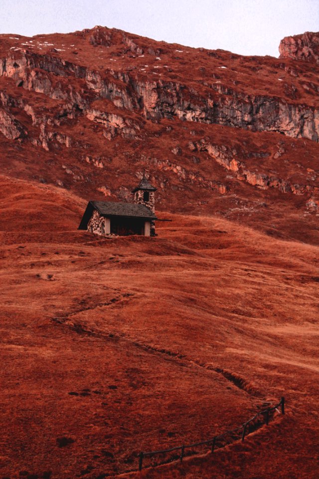 white and black house near mountain at daytime