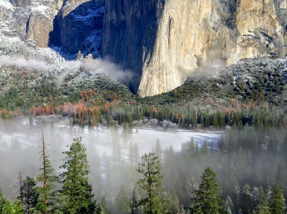 body of water near gray rock formation