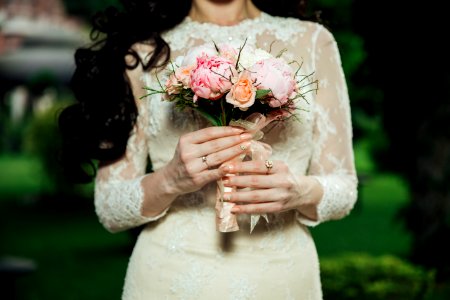 woman wearing white lace long-sleeved wedding dress photo