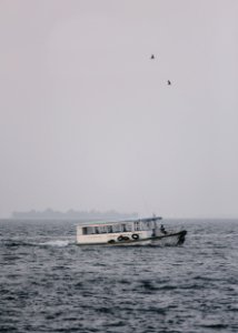 passenger boat during cloudy day photo