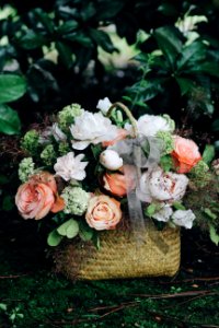 bouquet of white and pink flowers in basket photo