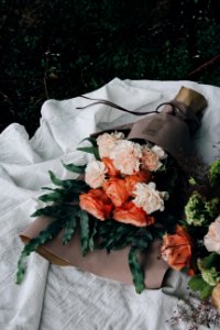 orange and pink petaled flower bouquet on table photo