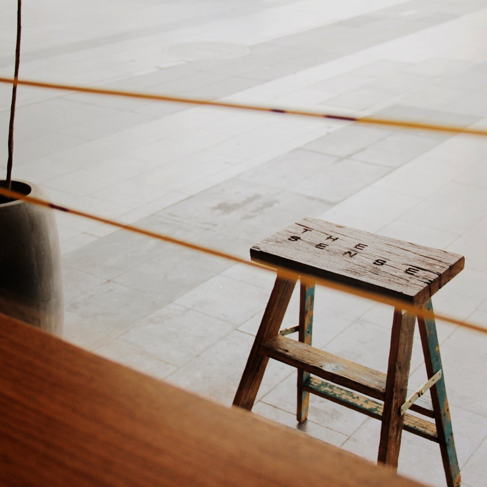 stool near brown vase