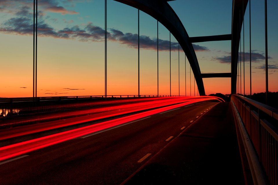 time lapse photo of cable bridge during golden hour