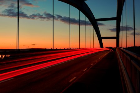 time lapse photo of cable bridge during golden hour