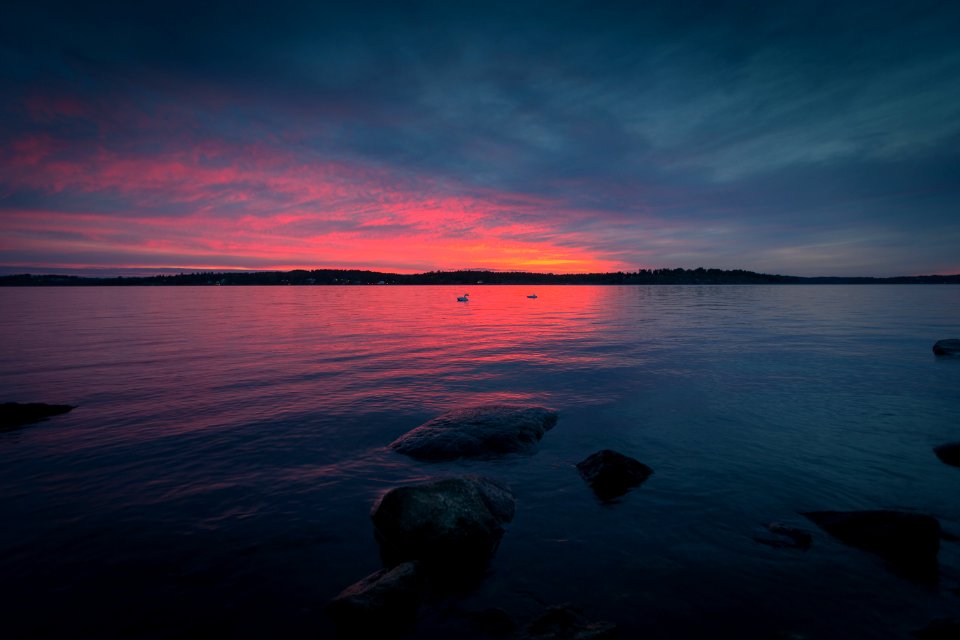 body of water during sunset