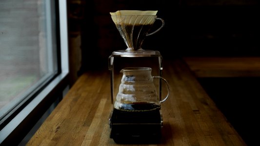 coffee pitcher on table near window photo