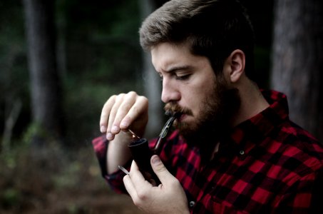 man smoking smoking pipe photo