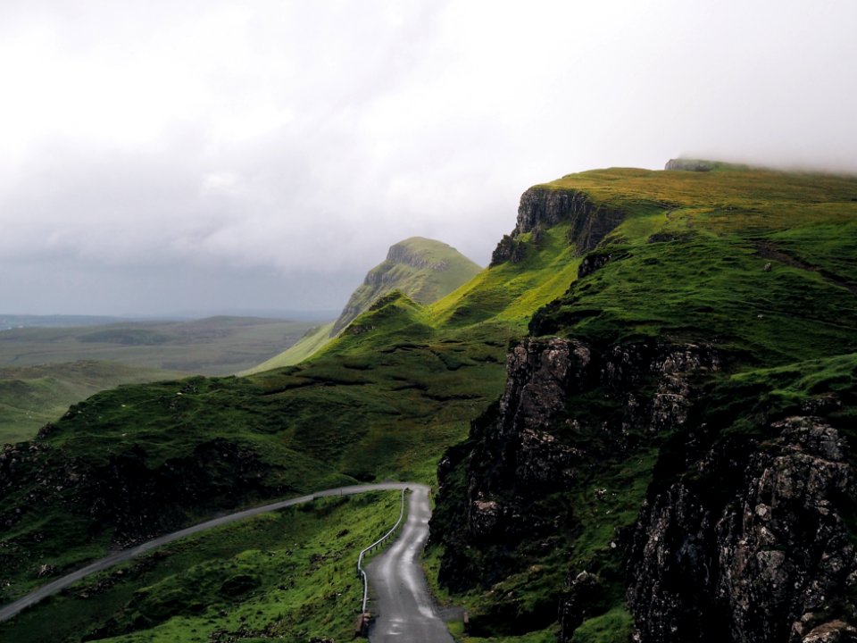 concrete road between mountains