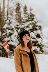 woman standing on snow covered place photo