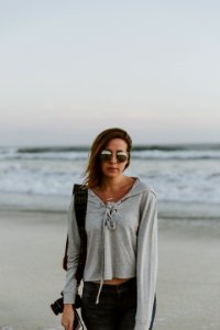 woman standing near body of water photo