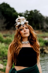woman wearing seashell crown in shallow focus photography photo