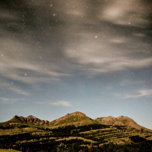 mountains under cloudy blue sky photo