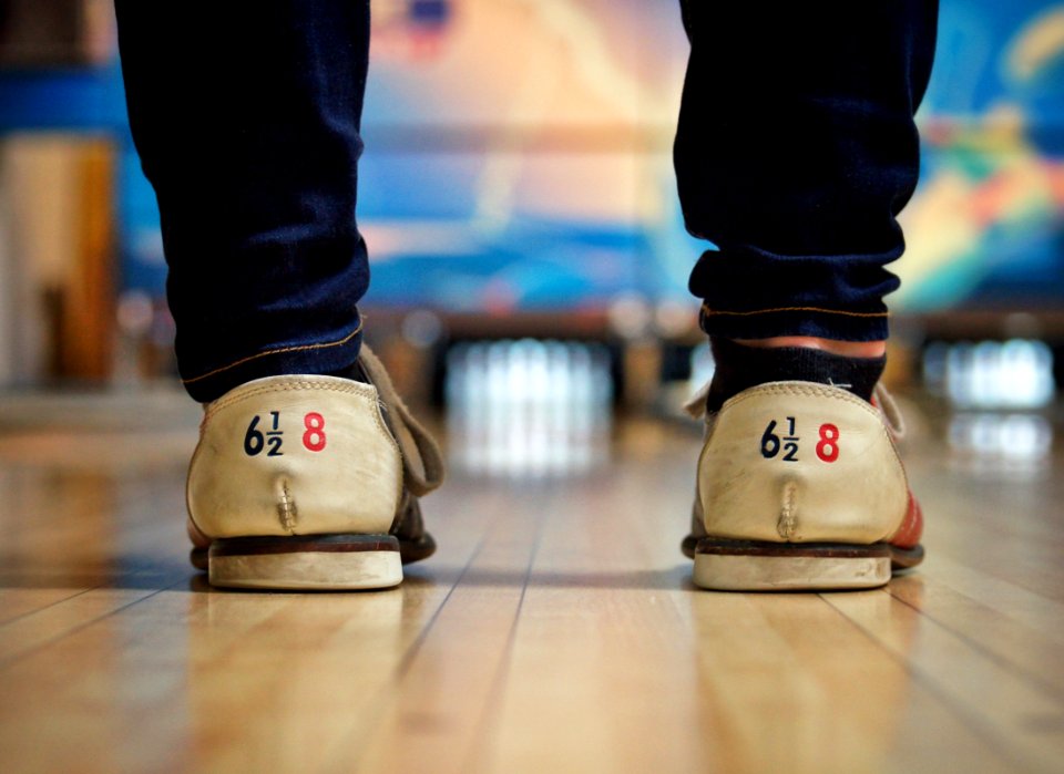 person standing on bowling court