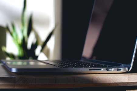 tilt shift lens photography of black laptop computer