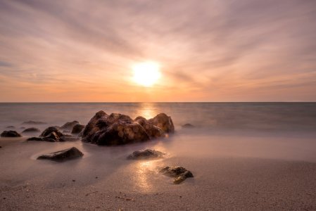 photo of rock in seashore photo