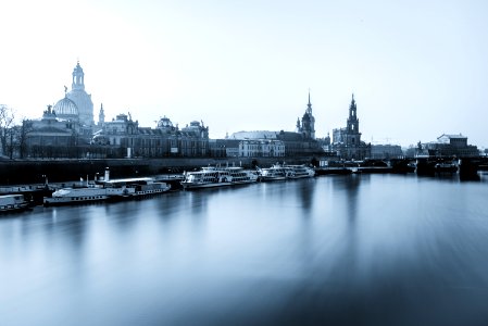 city buildings near body of water with yachts photo