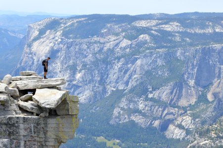man standing near cliff photo
