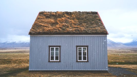 brown and gray house under blue sky photo