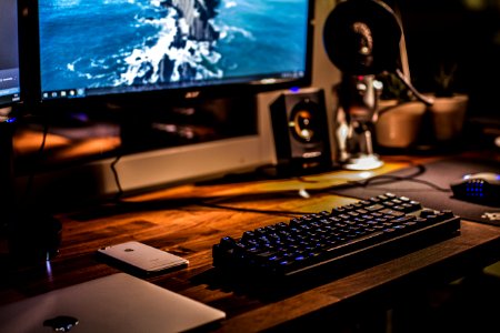 black corded gaming computer keyboard and flat screen monitor