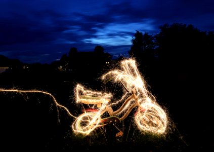 timelapse photograph of bicycle string lights photo