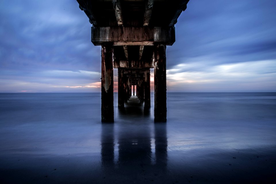 dock bridge near body of water