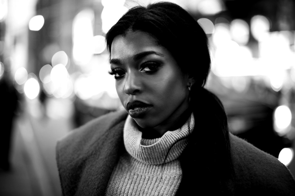 grayscale photo of woman wearigng coat