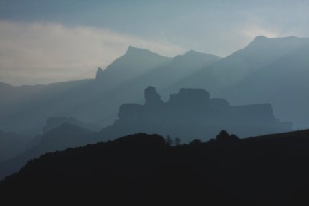 photo of foggy mountains during daytime photo