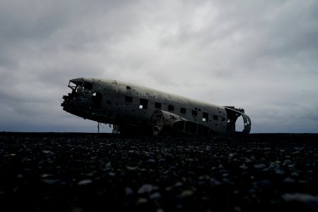 white plane on gray surface