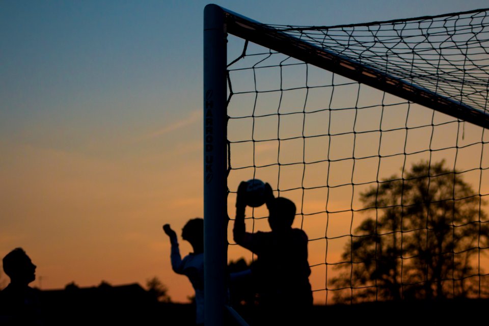 group of men playing soccer