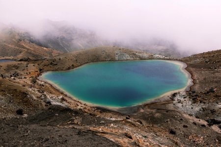 lake in the middle of mountain photo