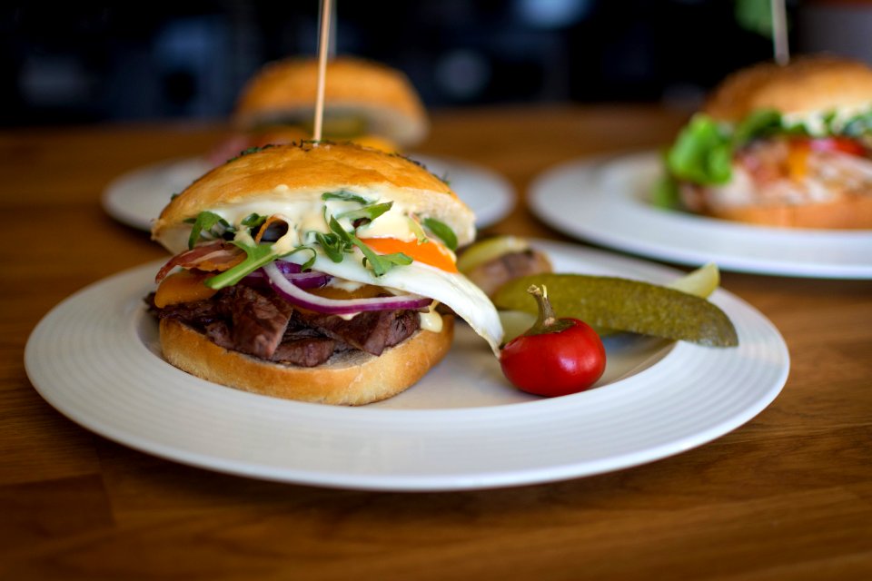 three plate of burgers