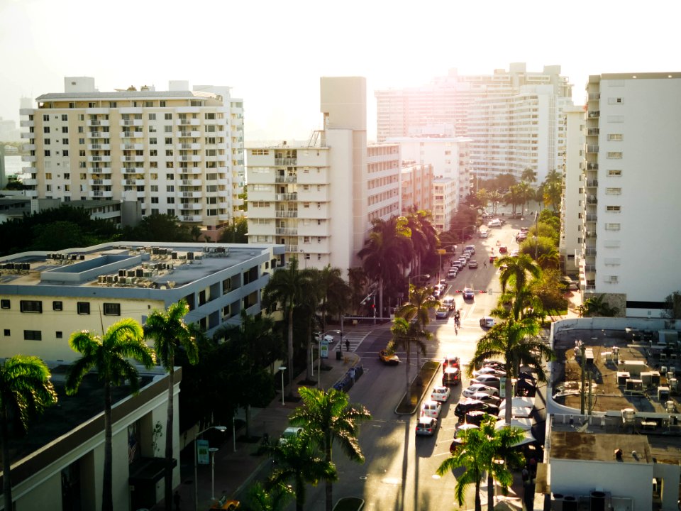 aerial view of vehicle passing between building during daytime photo