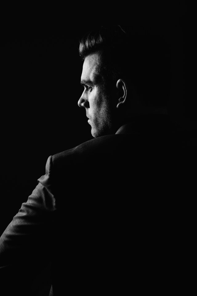 grayscale photo of man wearing blazer photo